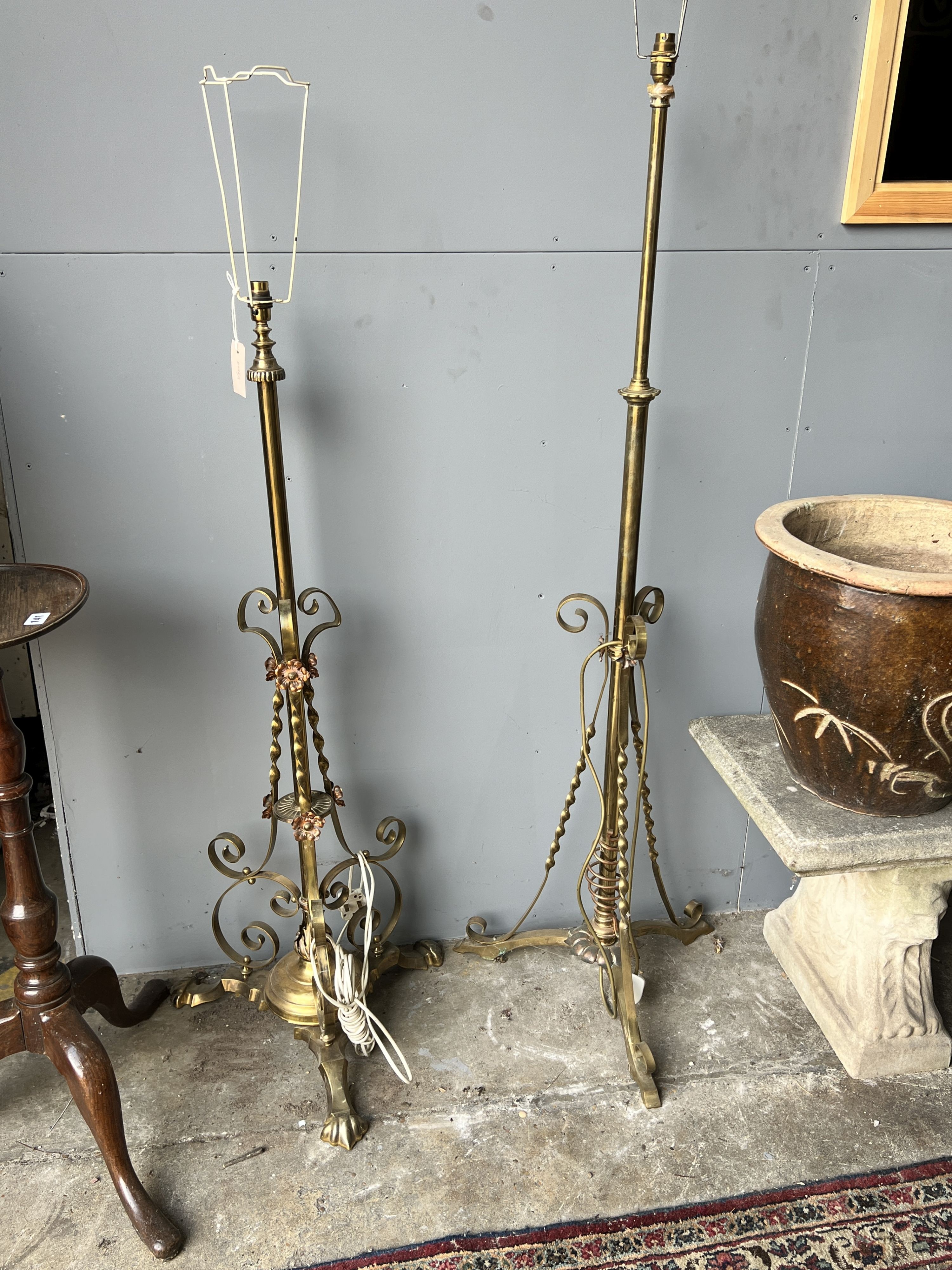 Two Edwardian brass telescopic standard lamps.